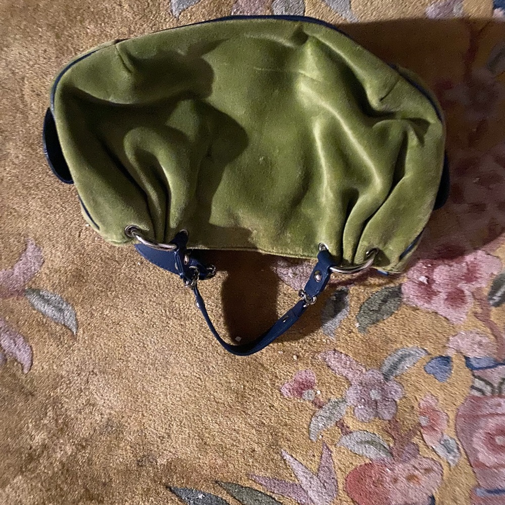 Juicy couture green vintage bag with a heart mirror and tag.